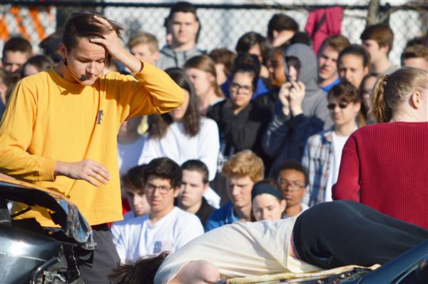 The drunk driver in Henderson's Mock Crash surveys the crash scene. 